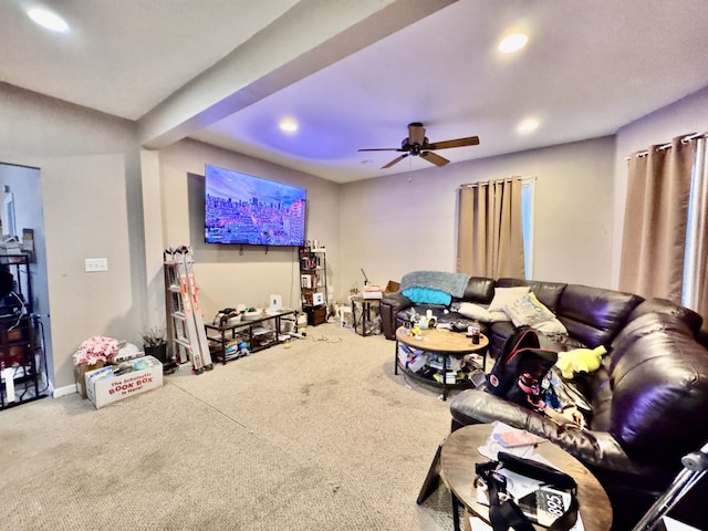 carpeted living room featuring ceiling fan