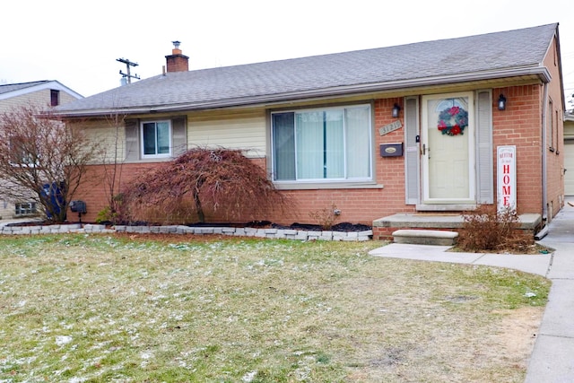 single story home with a front yard