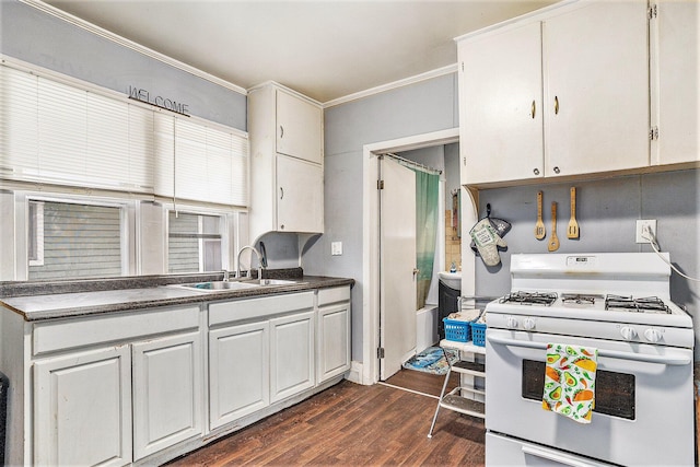 kitchen with sink, gas range gas stove, white cabinetry, ornamental molding, and dark hardwood / wood-style flooring