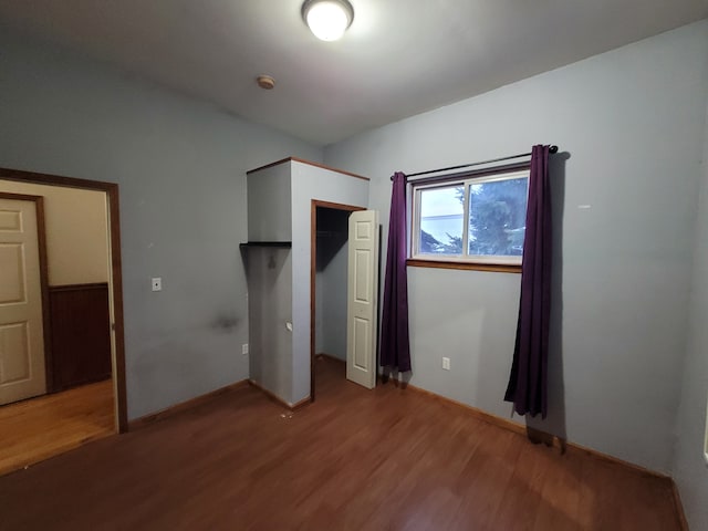 unfurnished bedroom with wood-type flooring