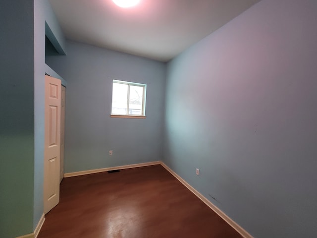 unfurnished room featuring wood-type flooring