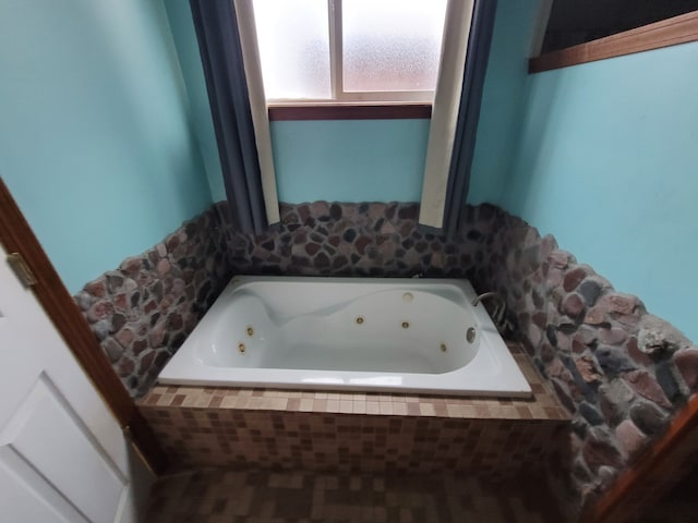 bathroom with tiled tub