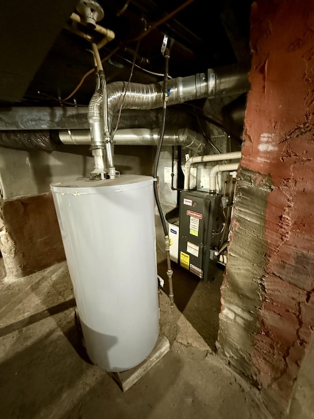 utility room featuring water heater