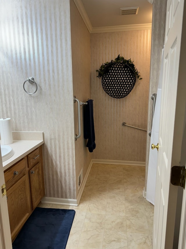 bathroom with crown molding and vanity