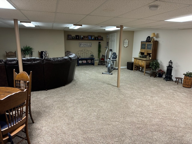 interior space featuring carpet and a paneled ceiling