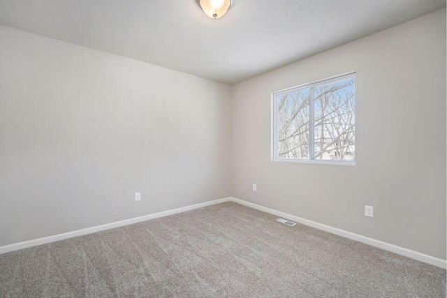 spare room featuring carpet flooring