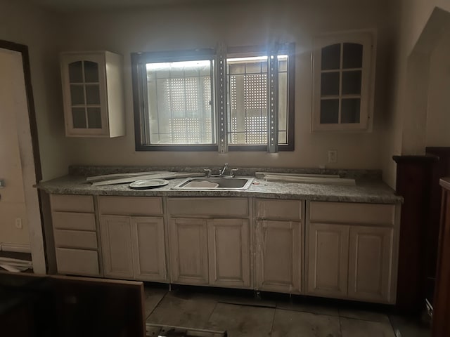 bathroom with tile patterned flooring and sink