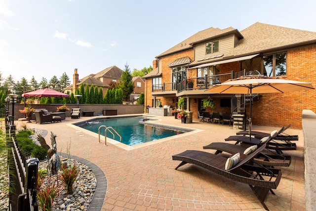 view of pool featuring a patio area