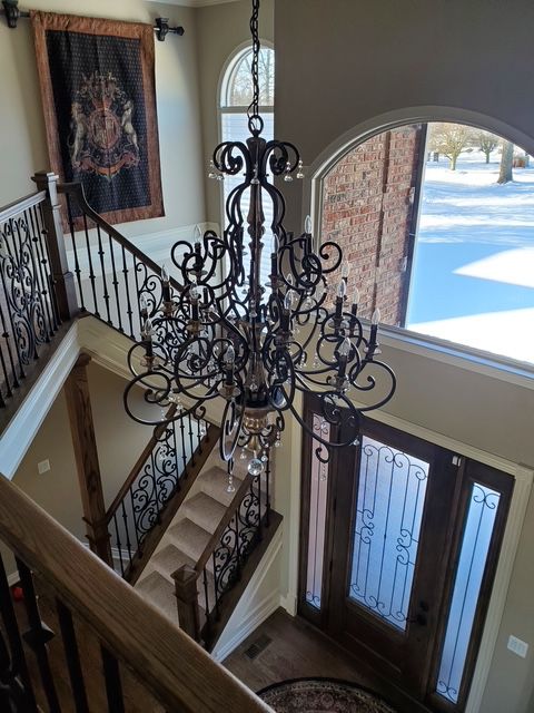 interior space featuring a chandelier and hardwood / wood-style flooring