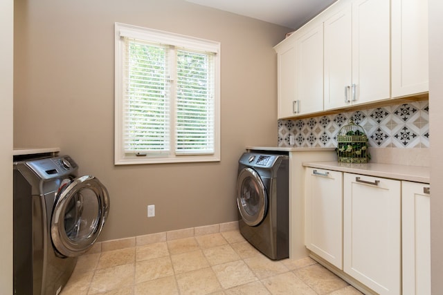 laundry area with cabinets and independent washer and dryer