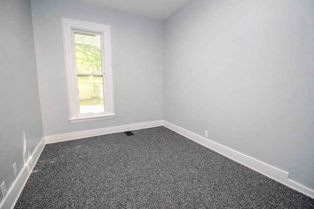 empty room featuring carpet flooring