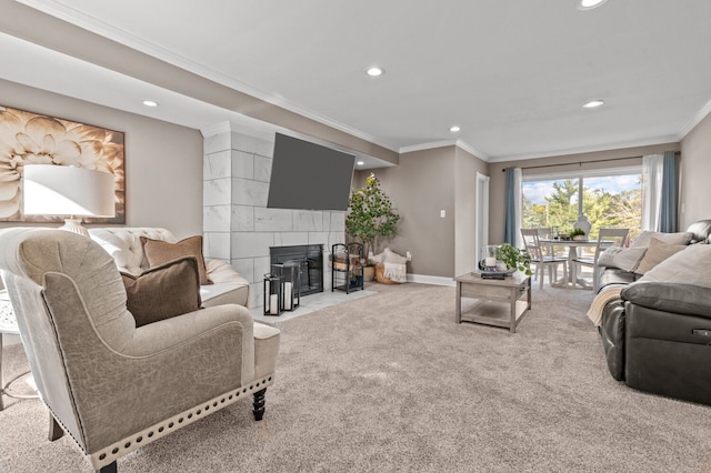 carpeted living room featuring a tiled fireplace and ornamental molding