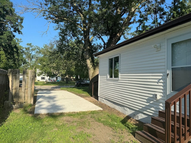 view of side of home featuring a patio area