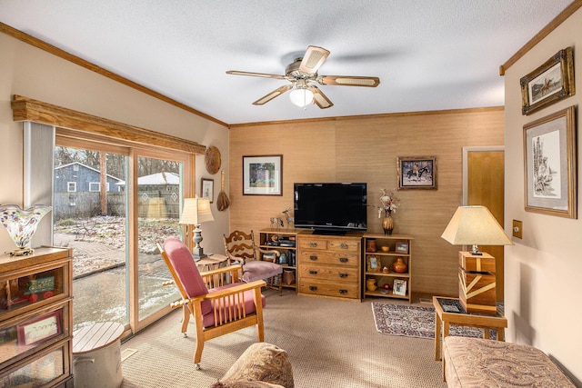 carpeted living room featuring ceiling fan, crown molding, and a textured ceiling