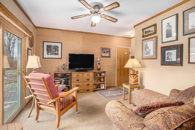 carpeted living room featuring ceiling fan and crown molding