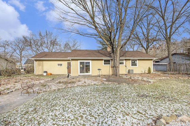 back of property with central AC unit