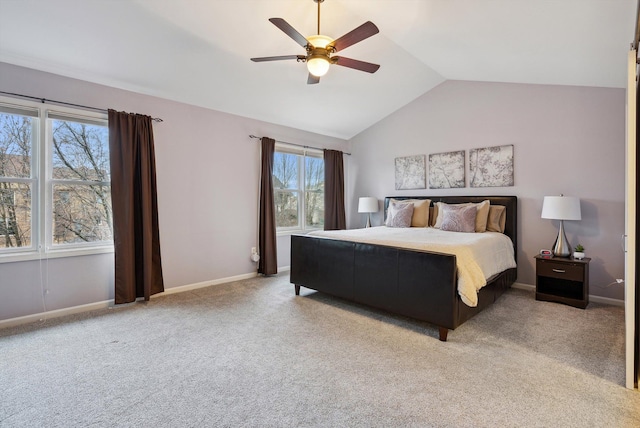 carpeted bedroom with ceiling fan and lofted ceiling