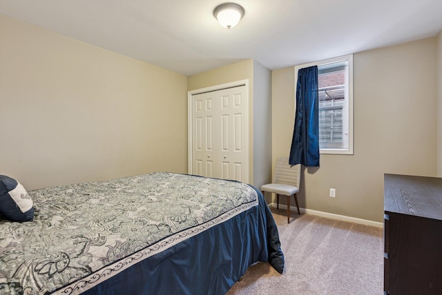 carpeted bedroom featuring a closet