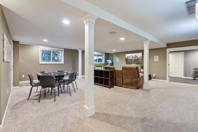 dining room featuring light carpet