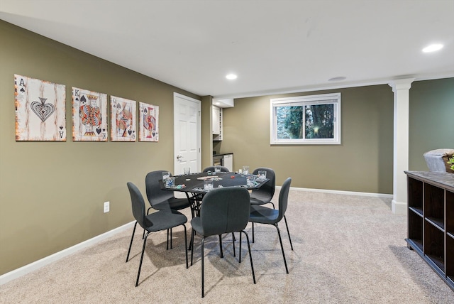 dining room featuring light colored carpet