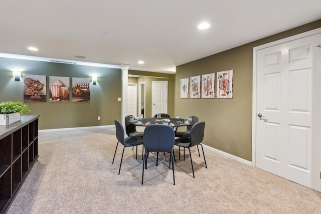 dining area with light colored carpet