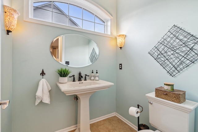 bathroom featuring tile patterned flooring and toilet