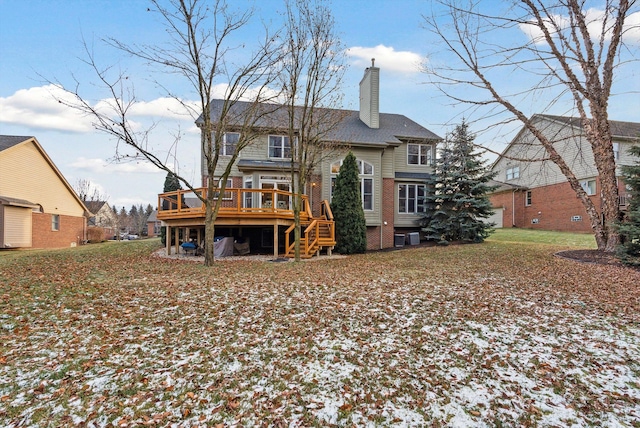 rear view of house with a wooden deck