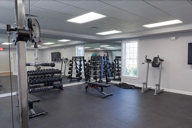 exercise room featuring a paneled ceiling