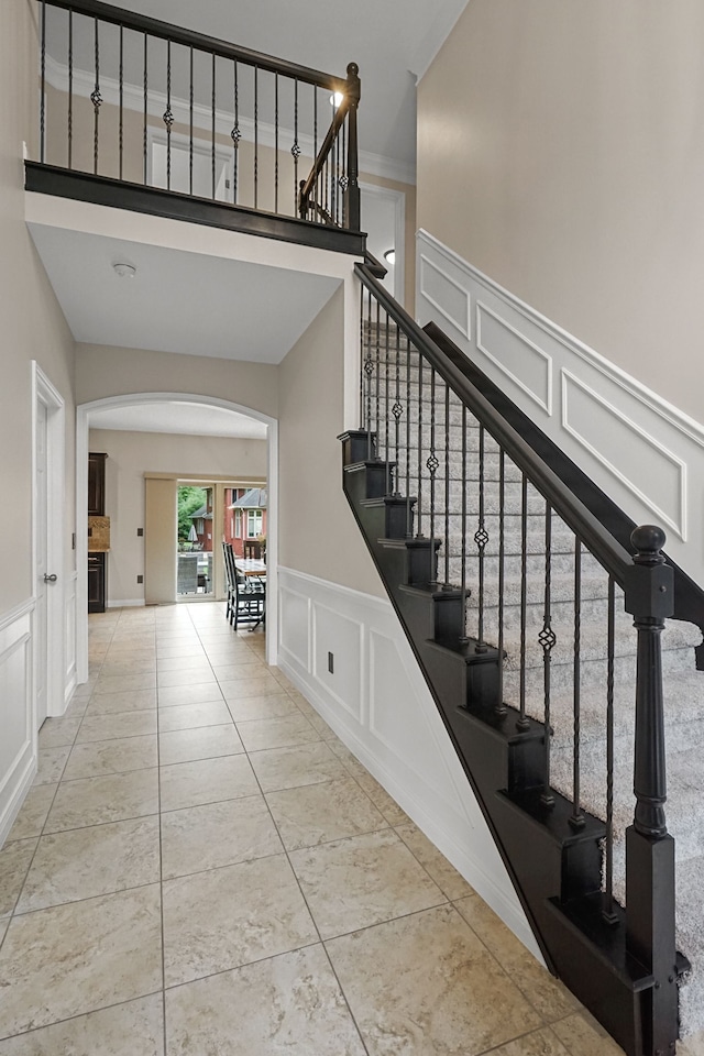 stairs with tile patterned floors