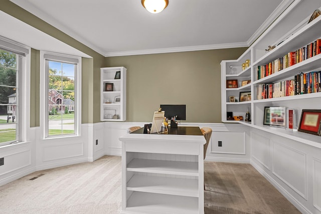 office area featuring light carpet and crown molding