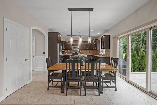 tiled dining area featuring sink