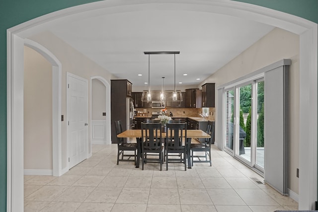 dining area with light tile patterned floors