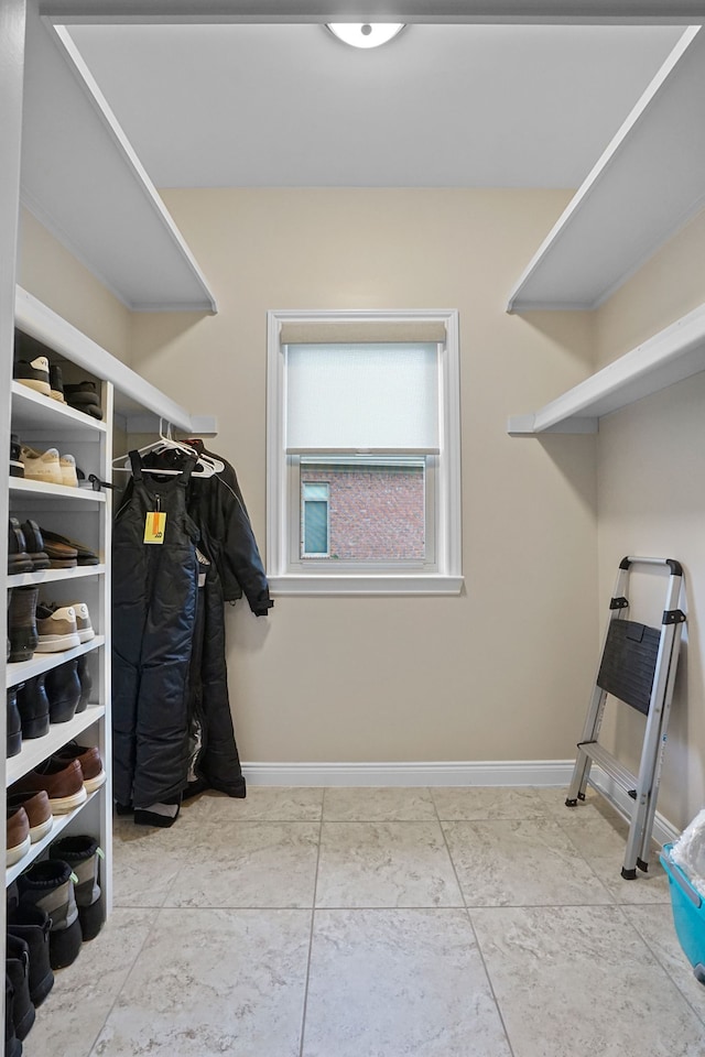 spacious closet featuring tile patterned floors