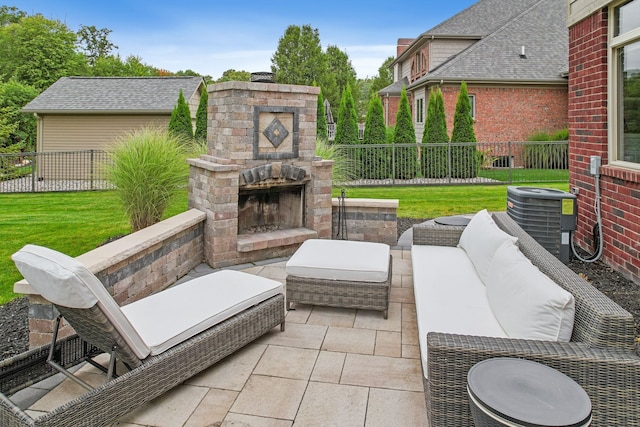 view of patio / terrace featuring an outdoor living space with a fireplace and central AC unit