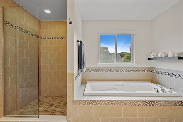 bathroom with separate shower and tub