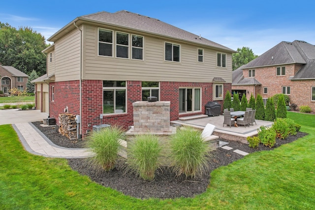 back of house featuring a patio area and a yard