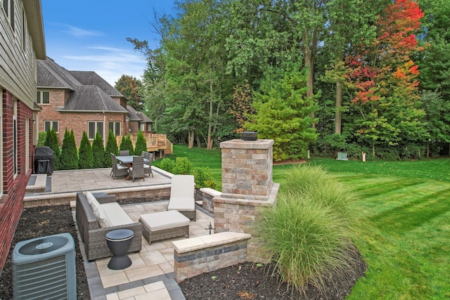 view of yard featuring a patio area and central air condition unit