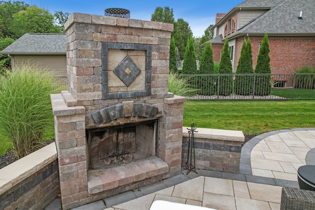 view of patio / terrace with an outdoor stone fireplace