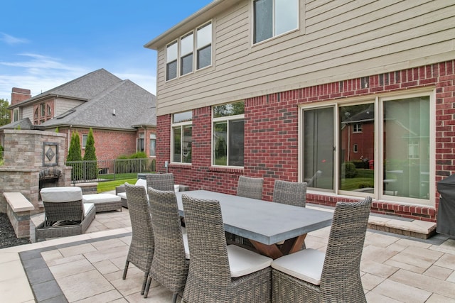 view of patio featuring a fireplace