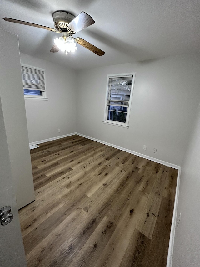 unfurnished room with hardwood / wood-style flooring and ceiling fan