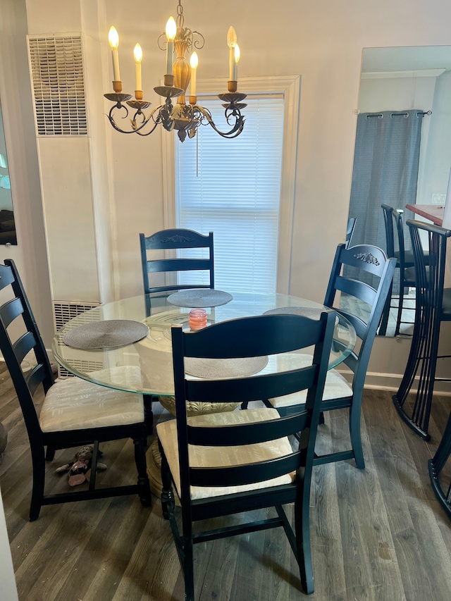 dining area with a notable chandelier and dark hardwood / wood-style floors