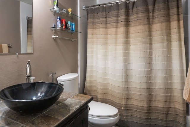 bathroom featuring sink and toilet