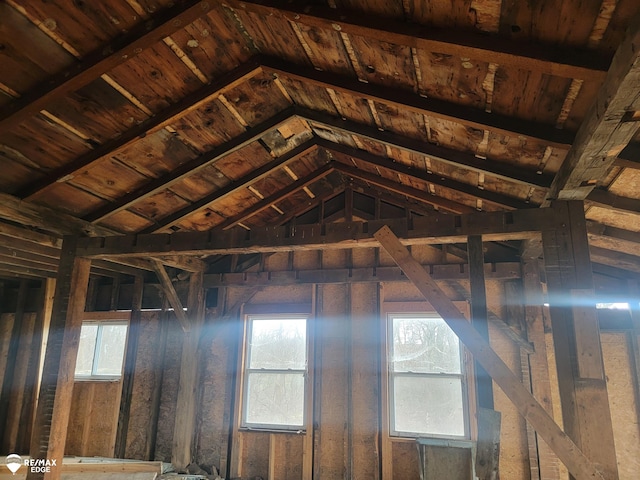 misc room with vaulted ceiling with beams, wooden ceiling, and a healthy amount of sunlight