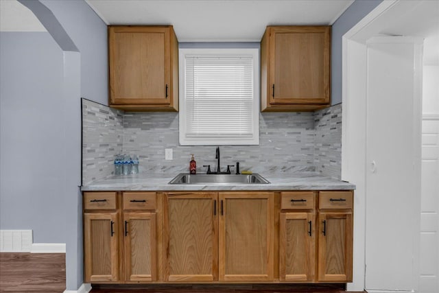 kitchen with tasteful backsplash and sink