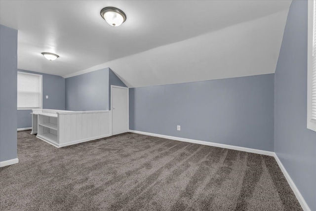 bonus room featuring lofted ceiling and carpet floors