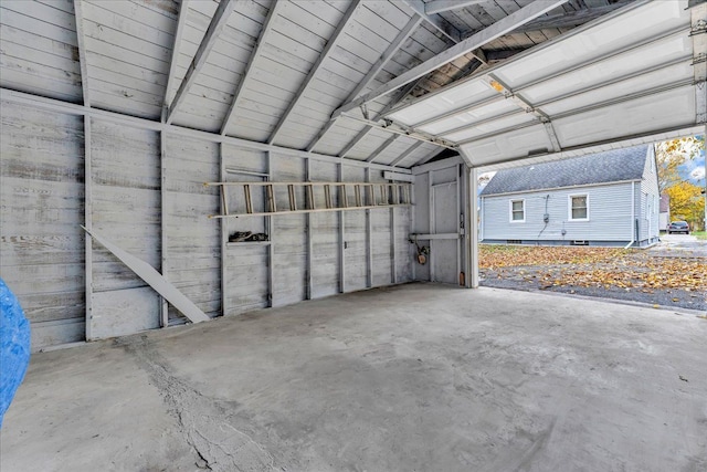 garage with wood walls and wood ceiling