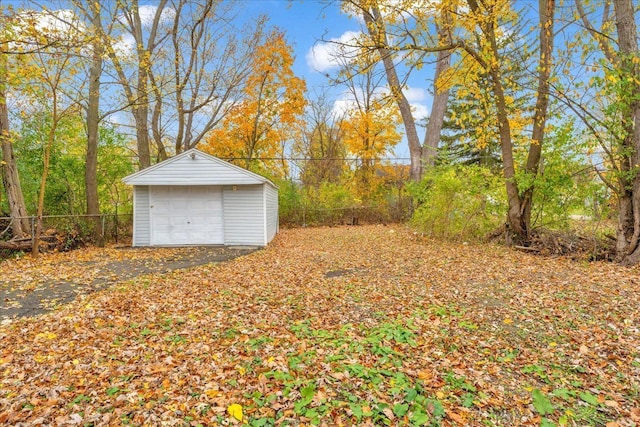 view of yard with a garage and an outdoor structure