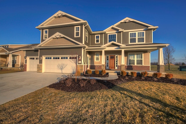 craftsman inspired home featuring a porch, a garage, and a front yard