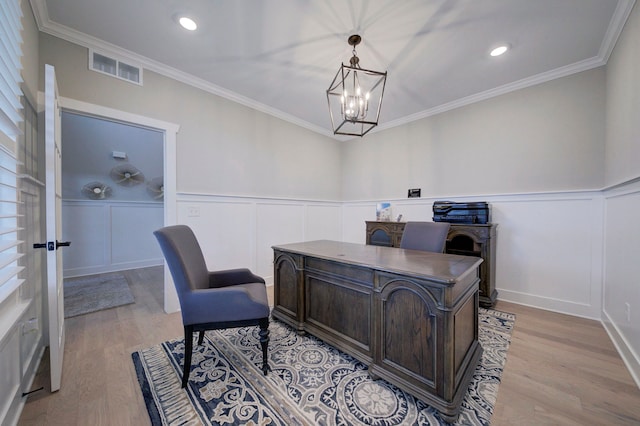 office space with light hardwood / wood-style flooring, a chandelier, and ornamental molding