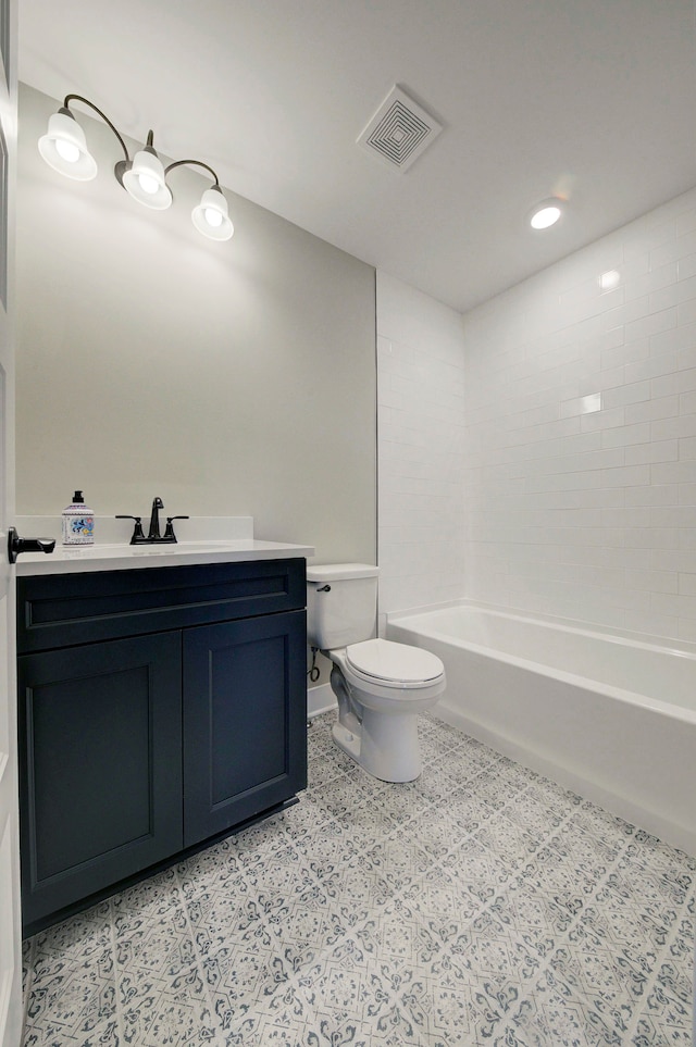 full bathroom with vanity, toilet, and tiled shower / bath